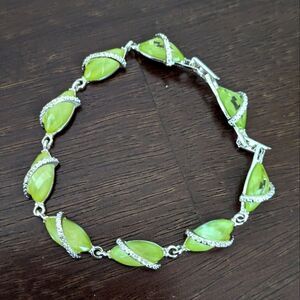 Avon Faux Citrine and Cubic Zirconia Silvertone Tennis Bracelet with Expander